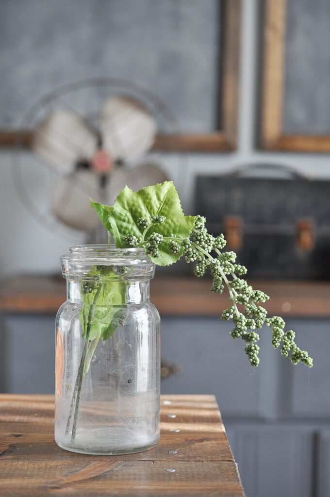 How to Decorate with Faux Greenery via Little Glass Jar